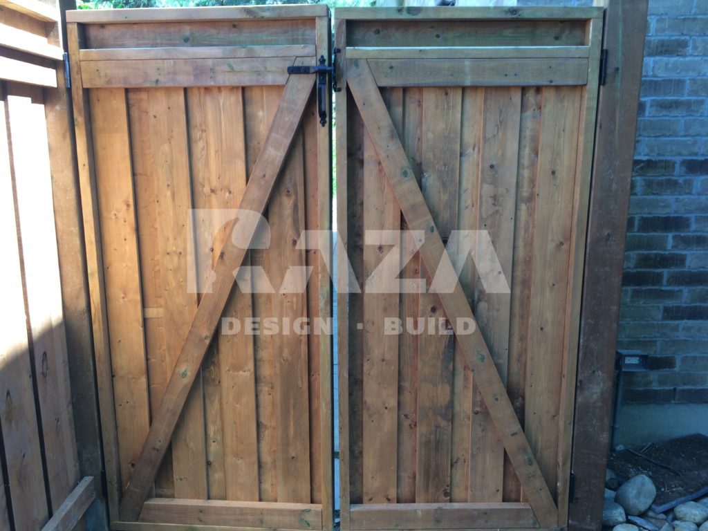 Back of brown pressure treated full privacy double gate