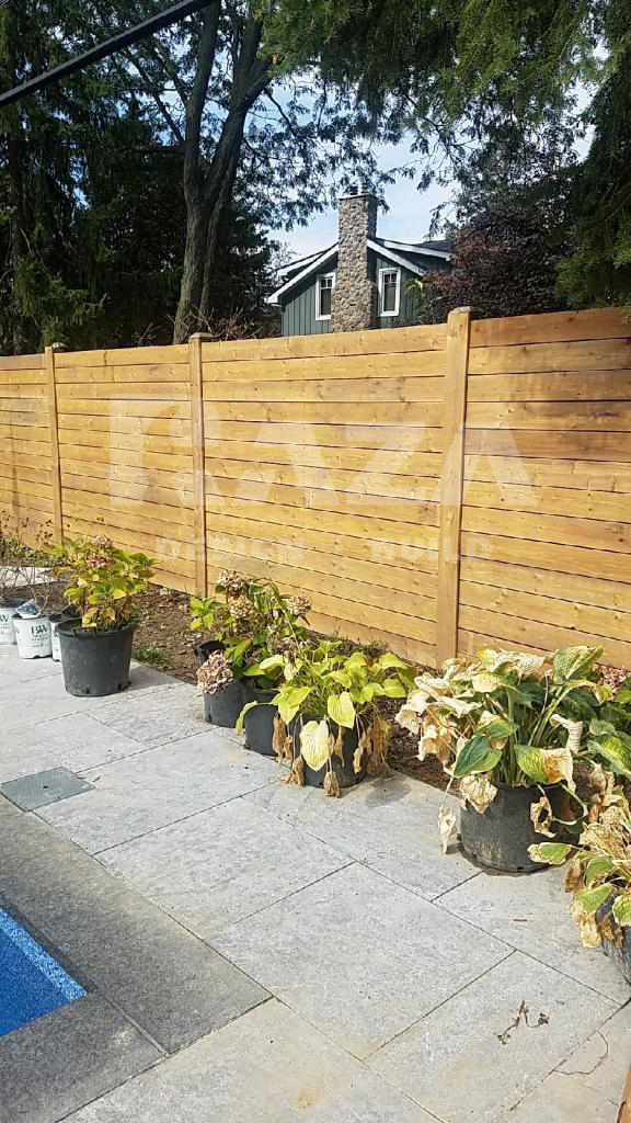 Brown pressure treated horizontal fence