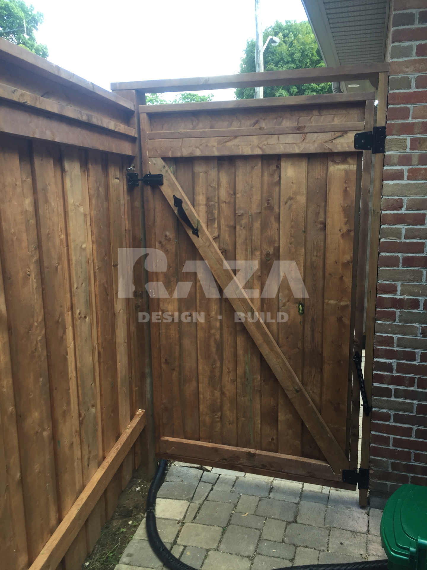 Brown pressure treated I-beam full privacy gate