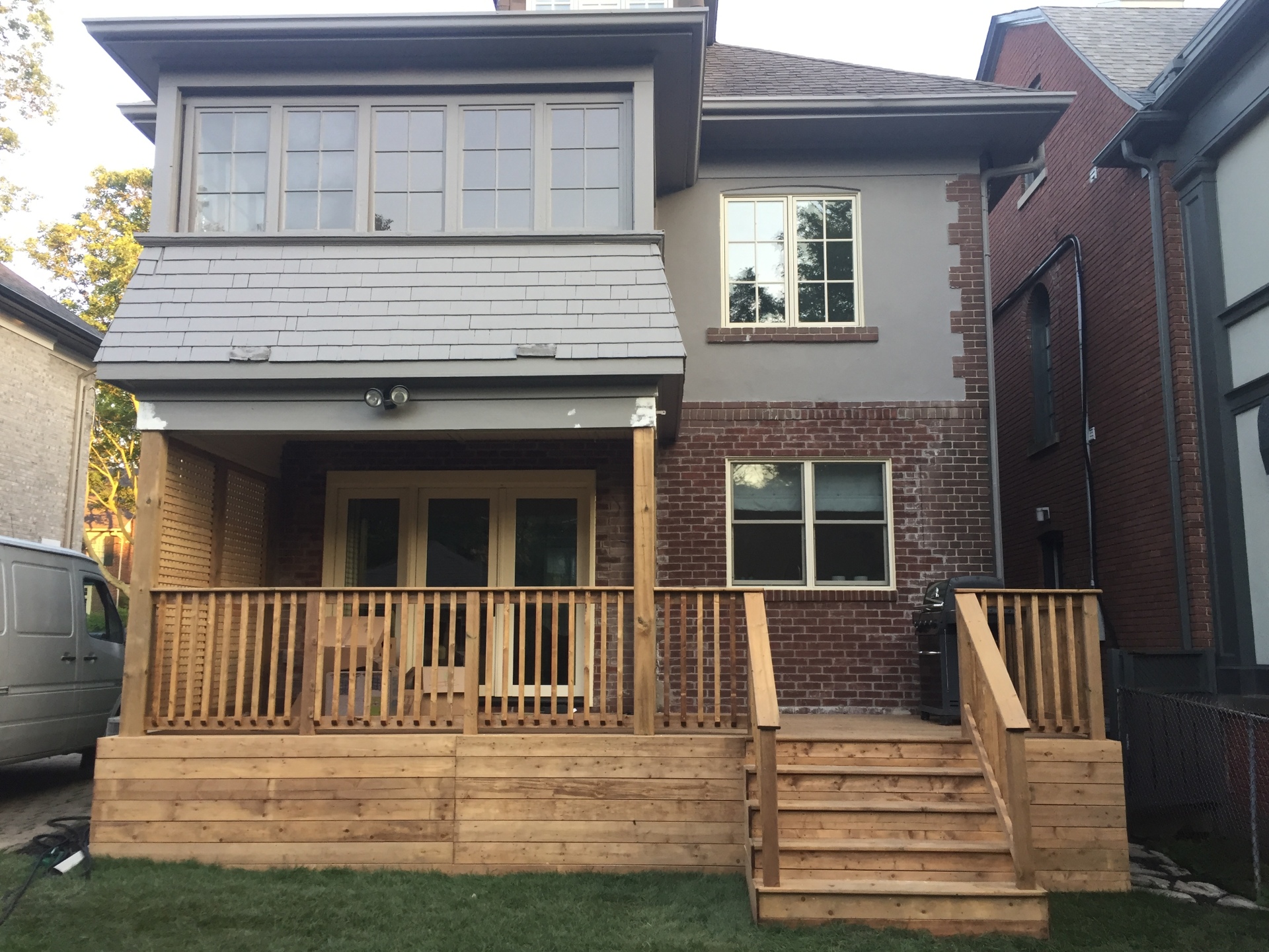 Pressure treated deck with builder railing, horizontal skirting and second story support