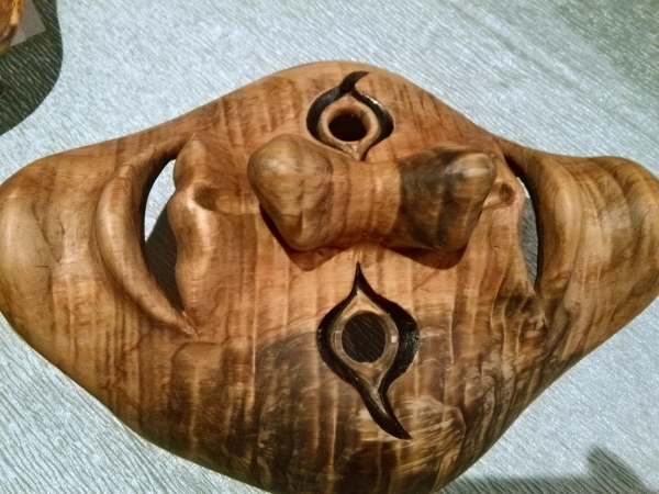 Two-faced mask of flamed Western red cedar