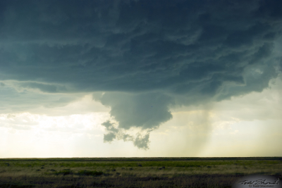 A wall cloud and scud clouds develop with a parent supercell over southeastern Colorado.