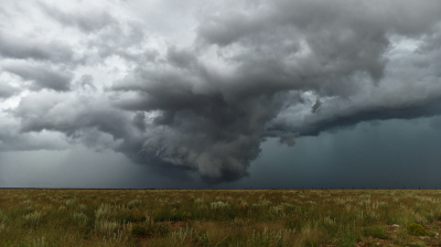A wall cloud hangs low and scrapes the floor of south central New Mexico floor in September 2014.
