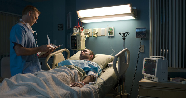 man in hospital bed