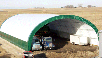 Fabric covered metal frame equipment storage hoop building