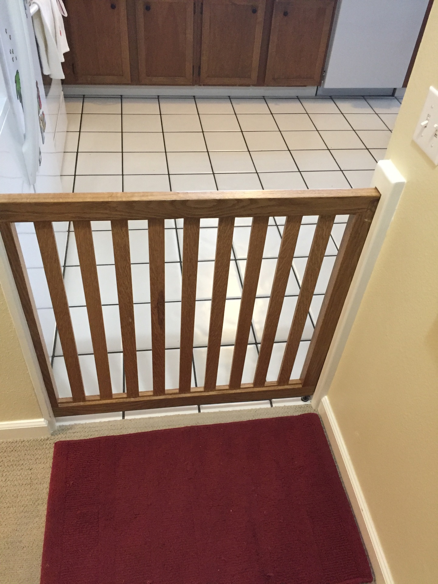 pocket dog gate; disappearing baby gate