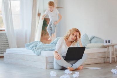 Mom working from home with toddlers