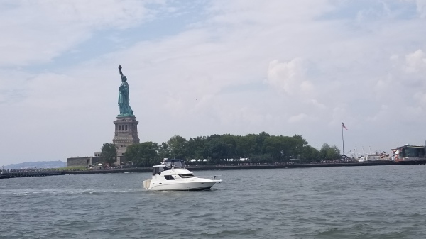 Our buddy boat in front of Statue of Liberty