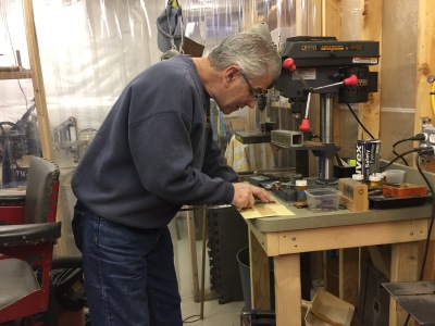 Bill Schrade in his shop making custom knives