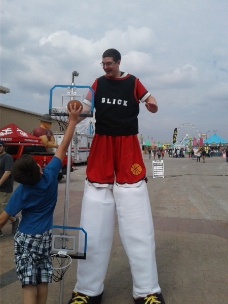 Everyone loves playing basketball with a stilt walker 