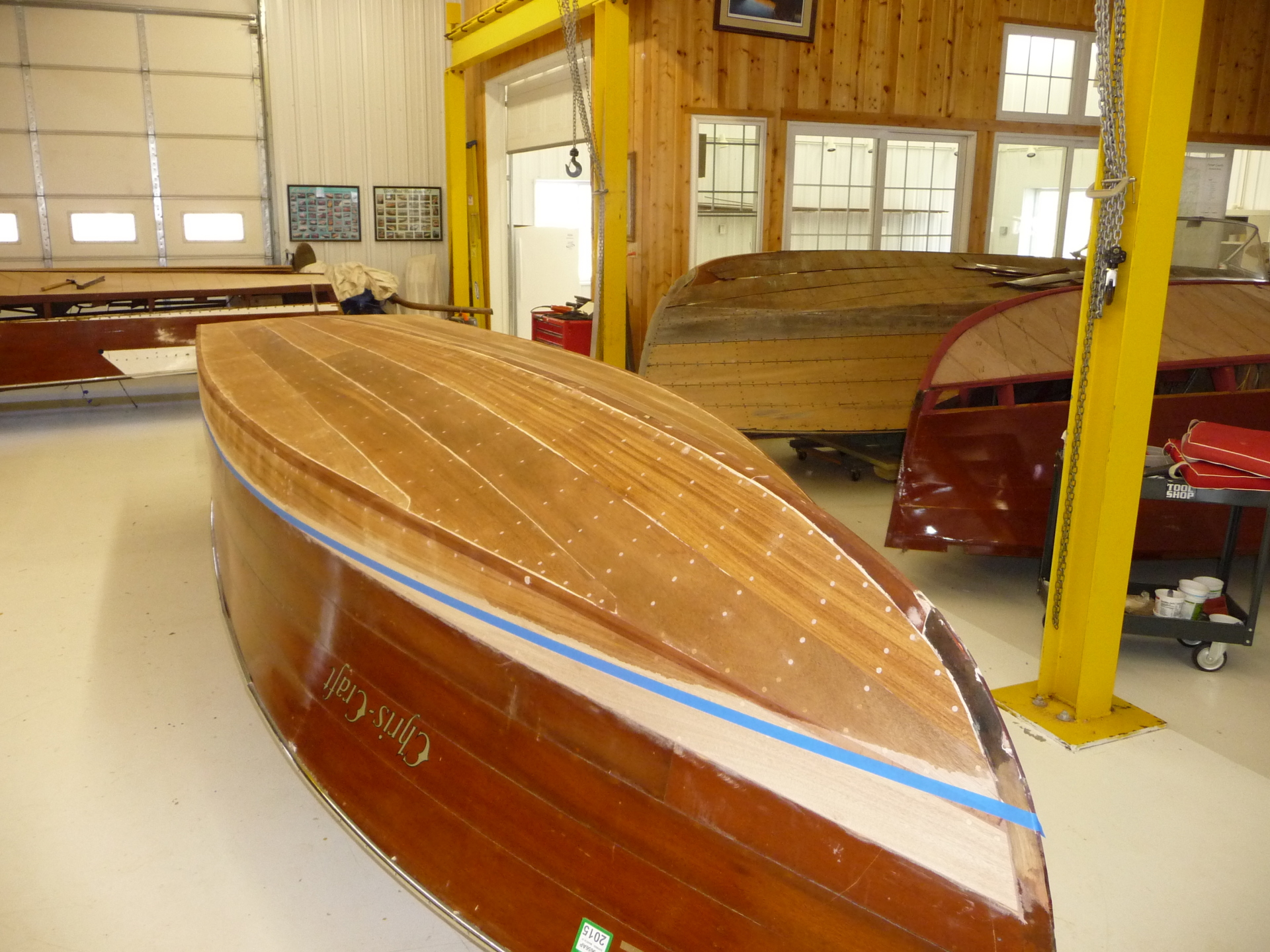 4 Chris Crafts in Various Stages of Bottom Replacement