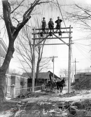 3 men on a new electric pole 1912 with horse wagon below