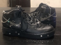 Nike Air Force 1's with added metal chains, Swarovski crystals, safety pins, and screws.