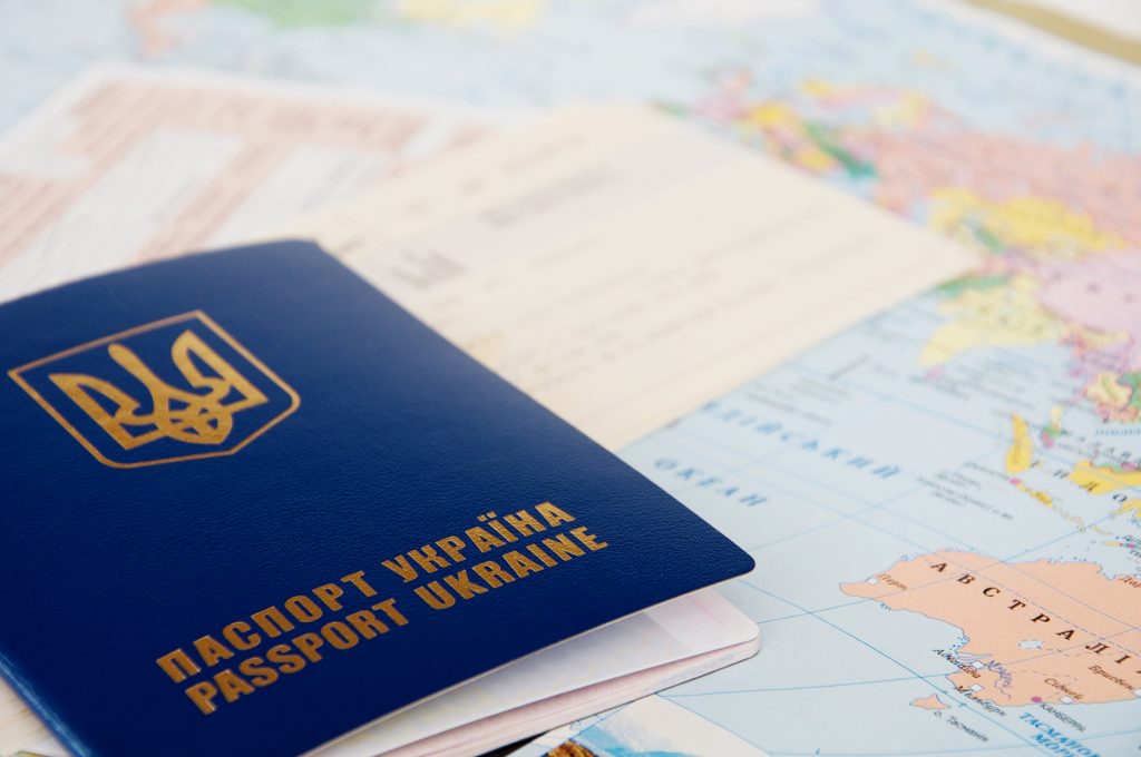 Passport and Tickets on a World Map