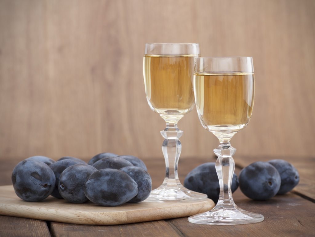 Plum brandy or schnapps with fresh and tasty plum