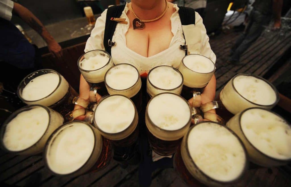 A waitress carries 12 litre-size glasses of beer in a beer tent during the Gillamoos folk festival in the southern German town of Abensberg on September 8, 2008. The world famous Oktoberfest beer festival will take place from September 20 to October 5, 2008 in Munich. AFP PHOTO DDP / OLIVER LANG GERMANY OUT (Photo credit should read OLIVER LANG/AFP/Getty Images)