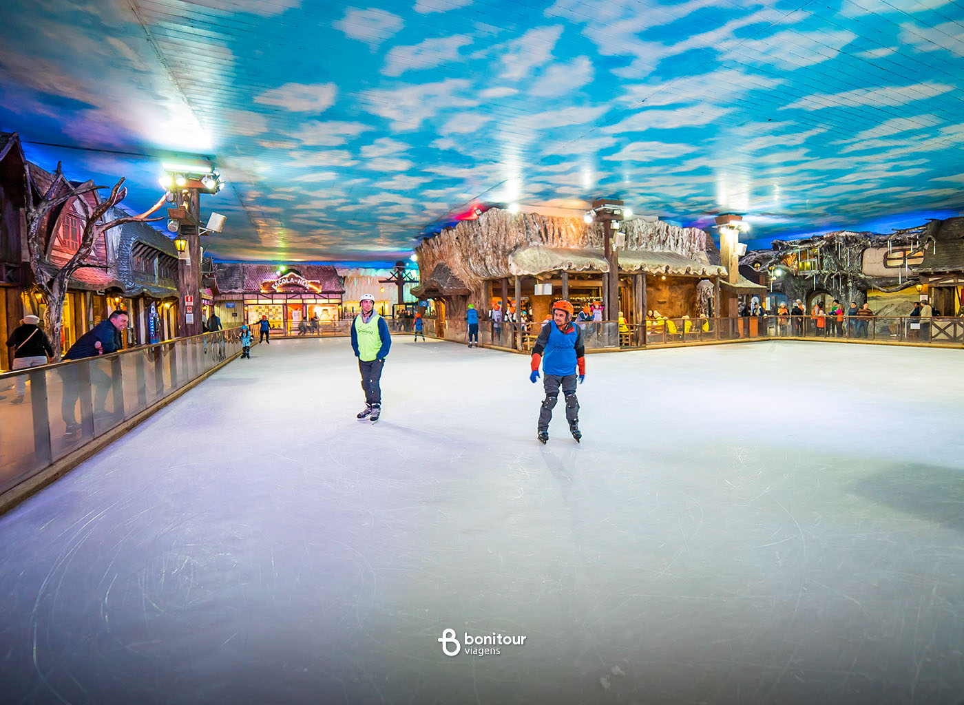Pessoas patinando no gelno na snowland