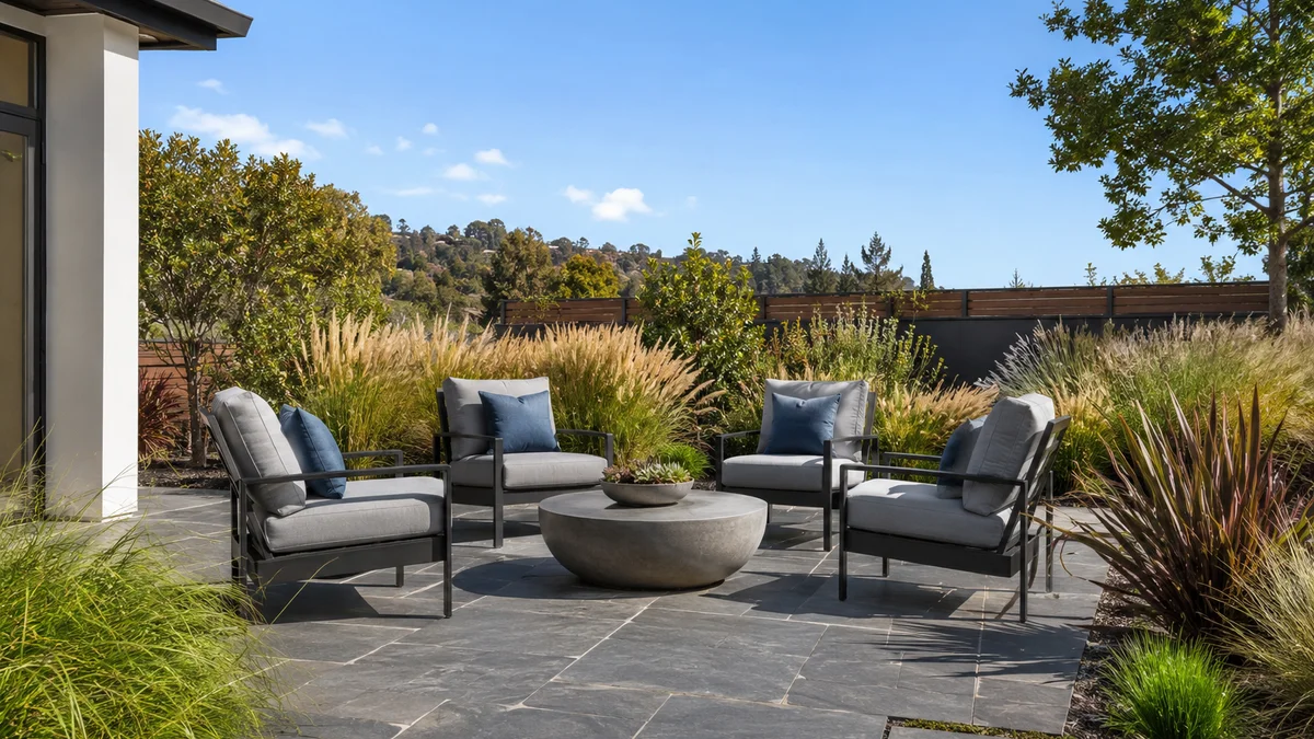 Modern patio with bluestone pavers and ornamental grasses