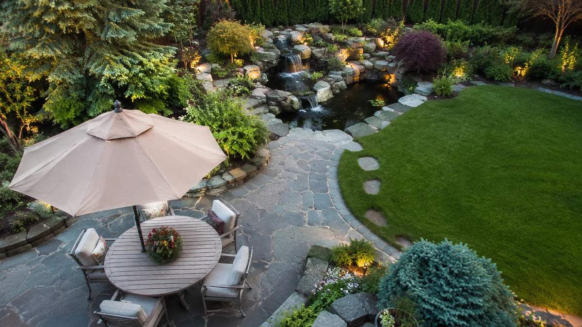 Overhead view of a transformed backyard with greenery and decor
