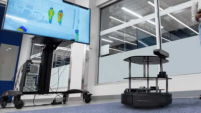 Autonomous Future Labs robotics facility with a mobile robot and monitoring screens