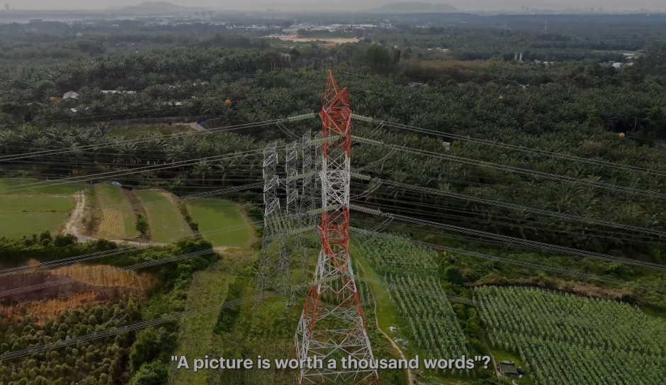 Drone view of transmission towers crossing agricultural land