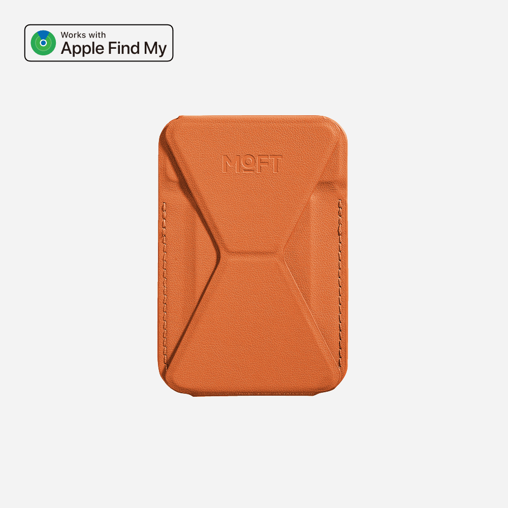 MOFT's orange MOVAS MagSafe wallet stand with a Works with Apple Find My badge