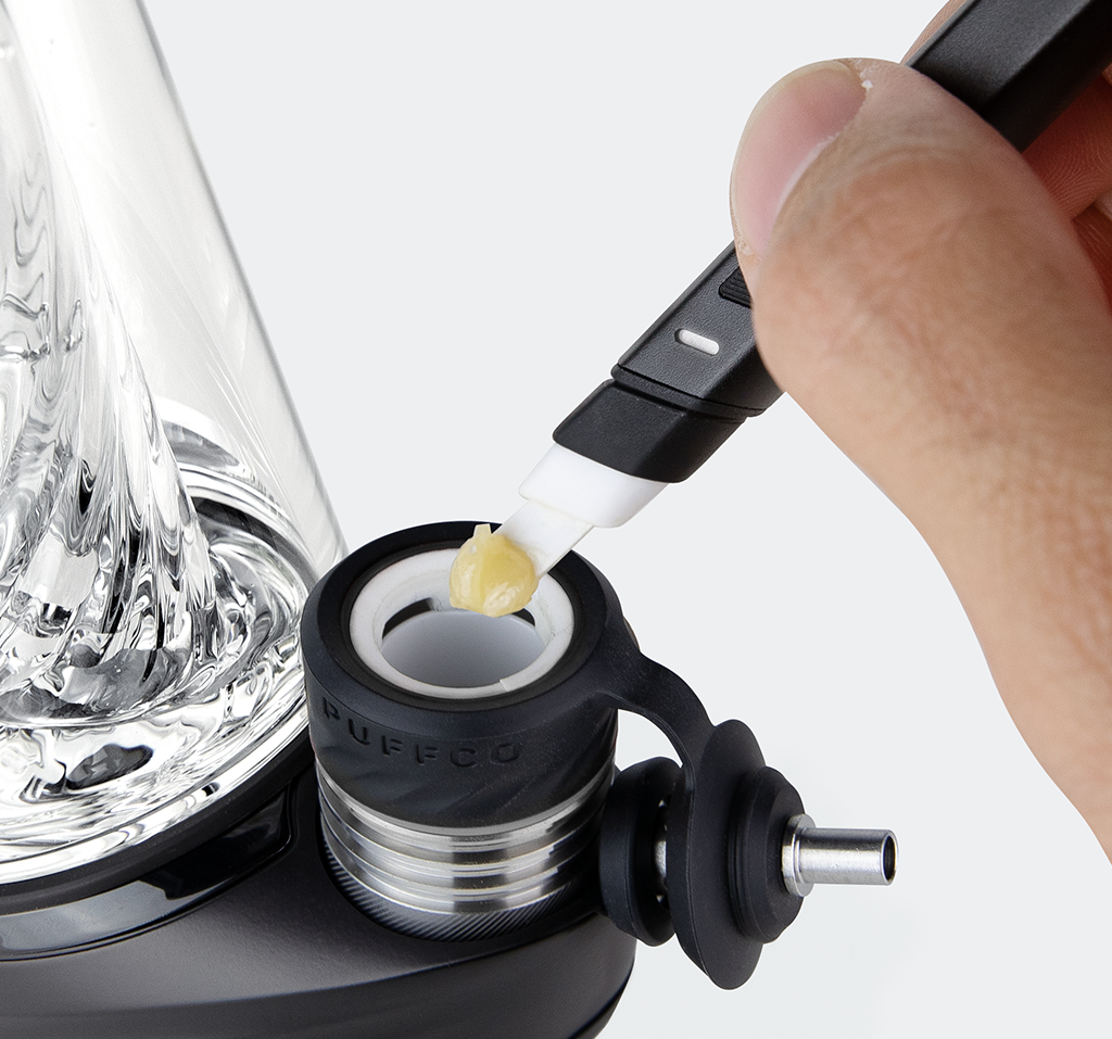 Puffco Peak Pro with concentrate being loaded into the chamber