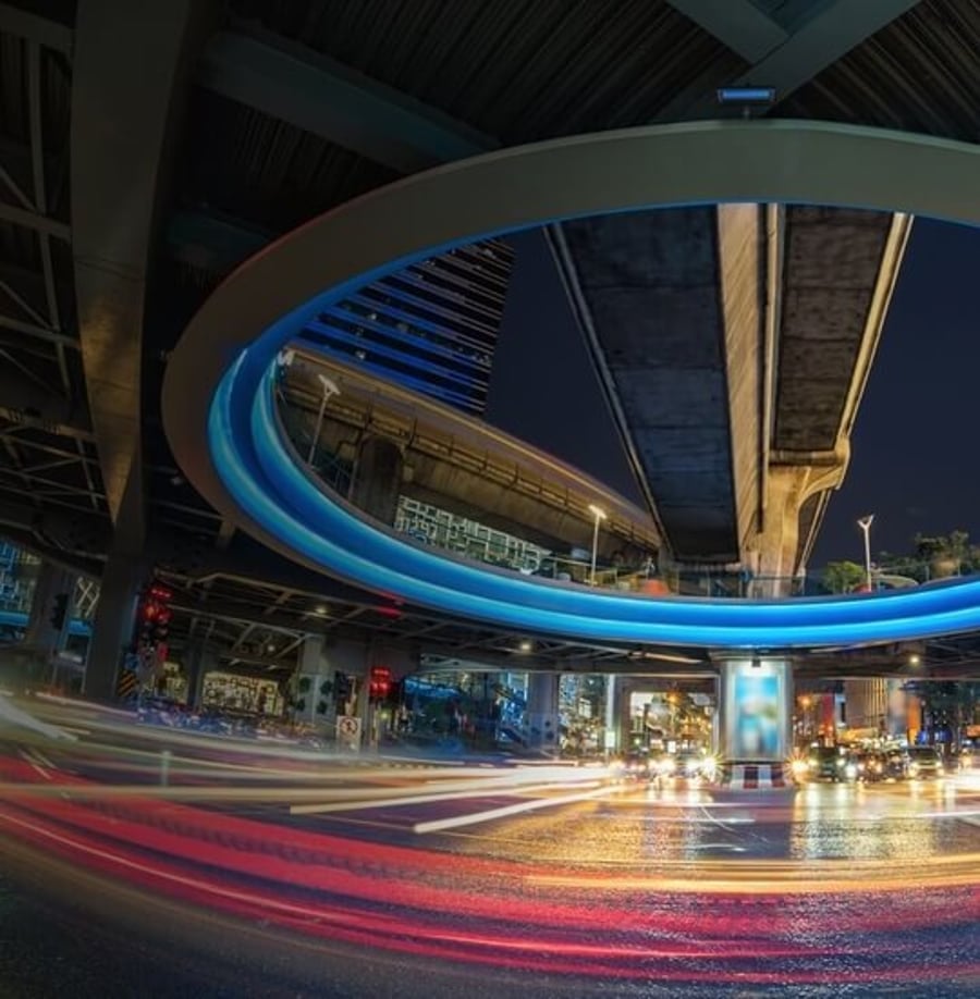 Raw Engineering - long-exposure light trails under a city interchange, the firm's brand image for digital transformation