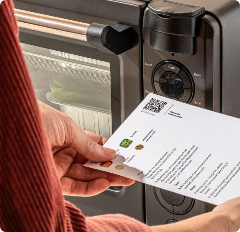 Scanning a Tovala meal barcode at the oven