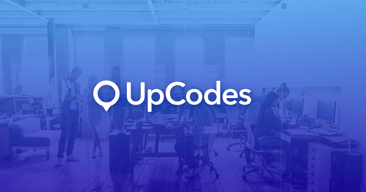 UpCodes logo over the company's open-plan office