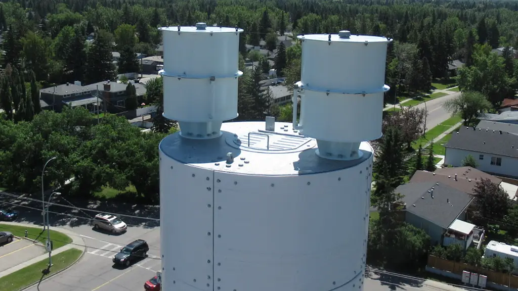 Twin white tuned liquid dampers installed on top of a monopole tower