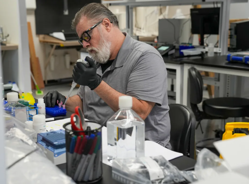 A Varro staff member pipetting at the R&D facility