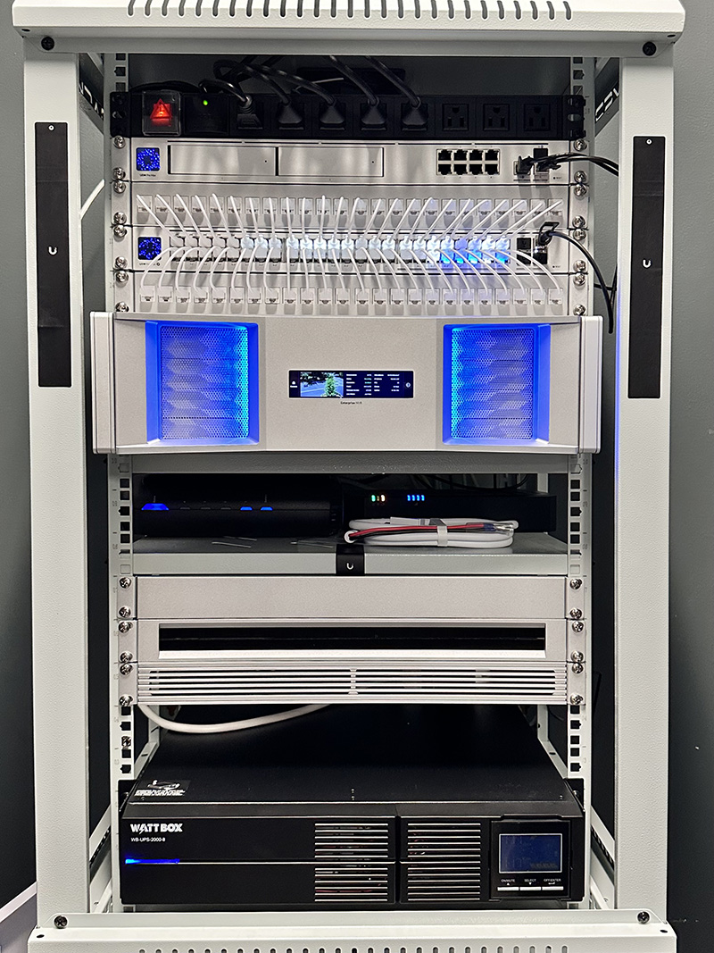 Ubiquiti UniFi network rack with Dream Machine Pro Max and switches deployed by YesTechie for high-security warehouse