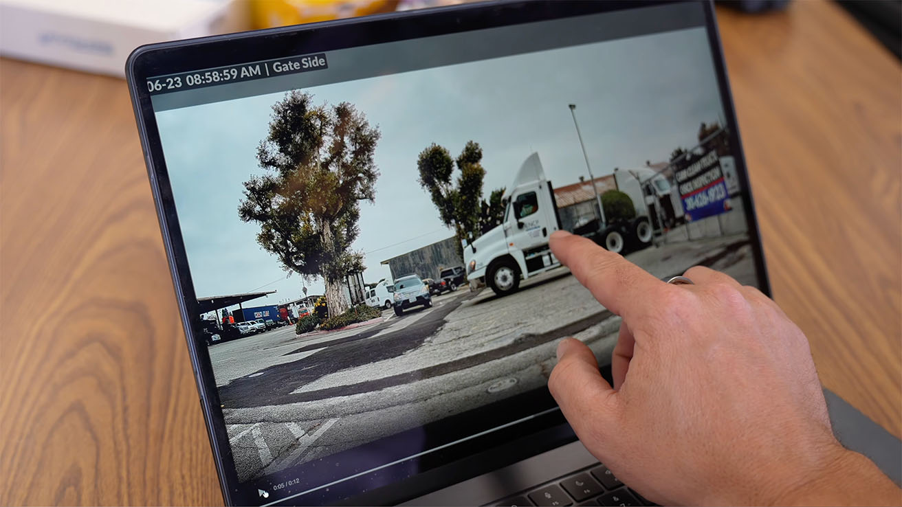 Engineer reviewing extracted USDOT and vehicle metadata tiles on a laptop screen
