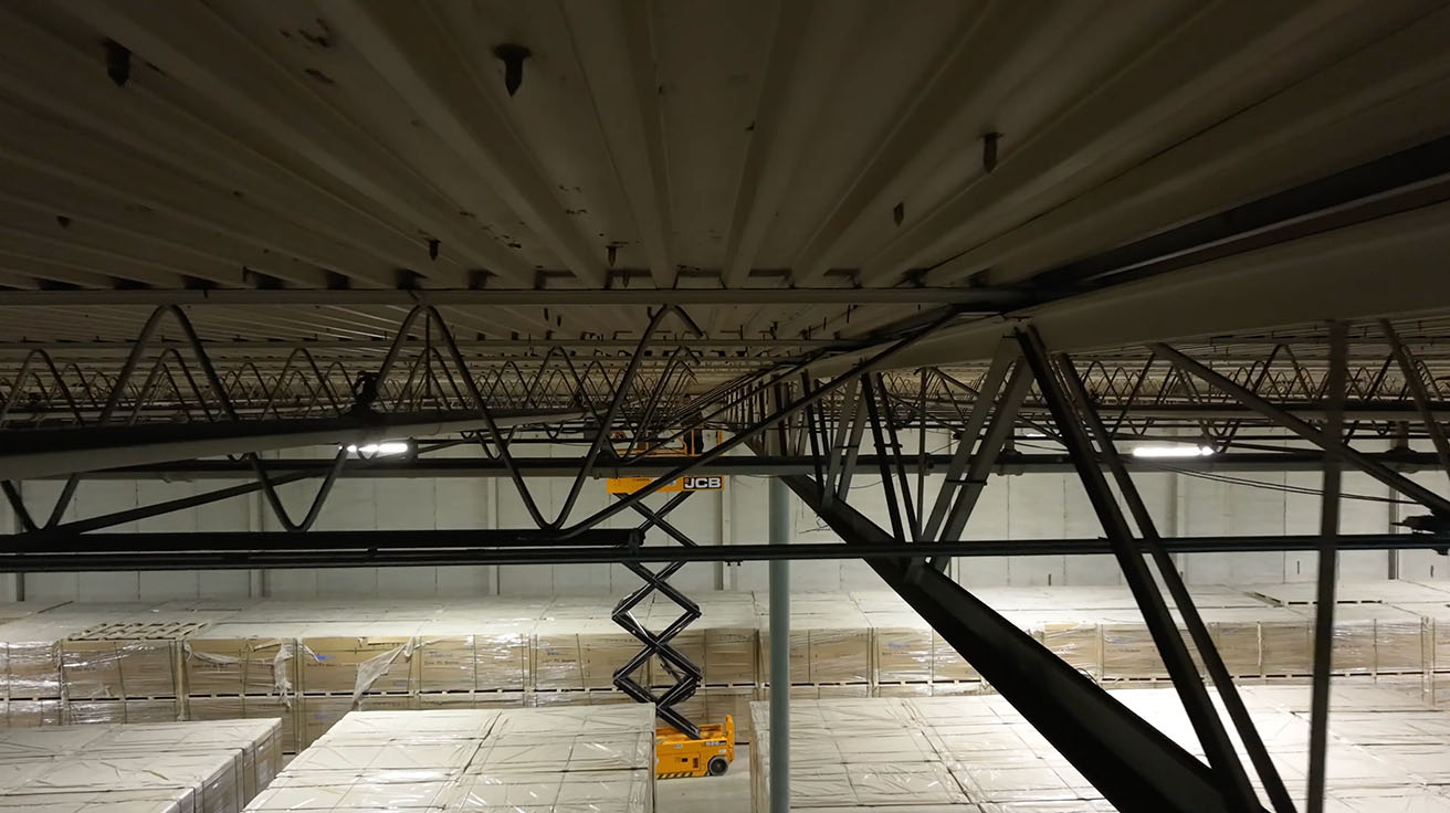 Structural ceiling view of a commercial logistics facility before structured cabling installation