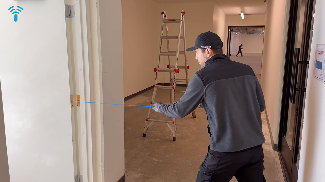 Drilling through door for electrified hinge