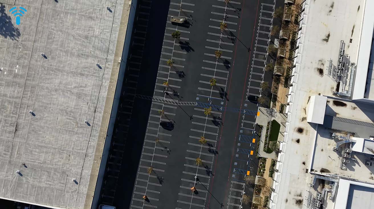 Aerial drone view of an outdoor commercial parking lot