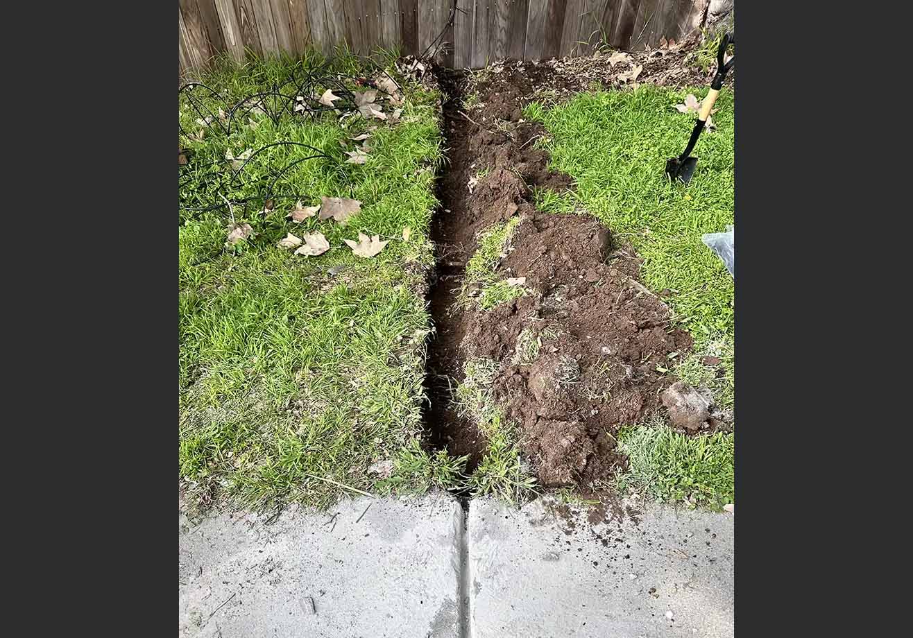 Digging trench for ethernet cable.