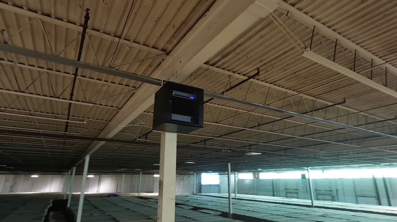 Wall-mounted Intermediate Distribution Frame IDF enclosure inside the warehouse