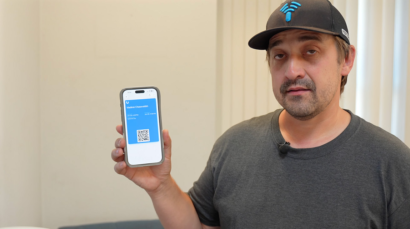 visitors use an iPad to scan a QR code