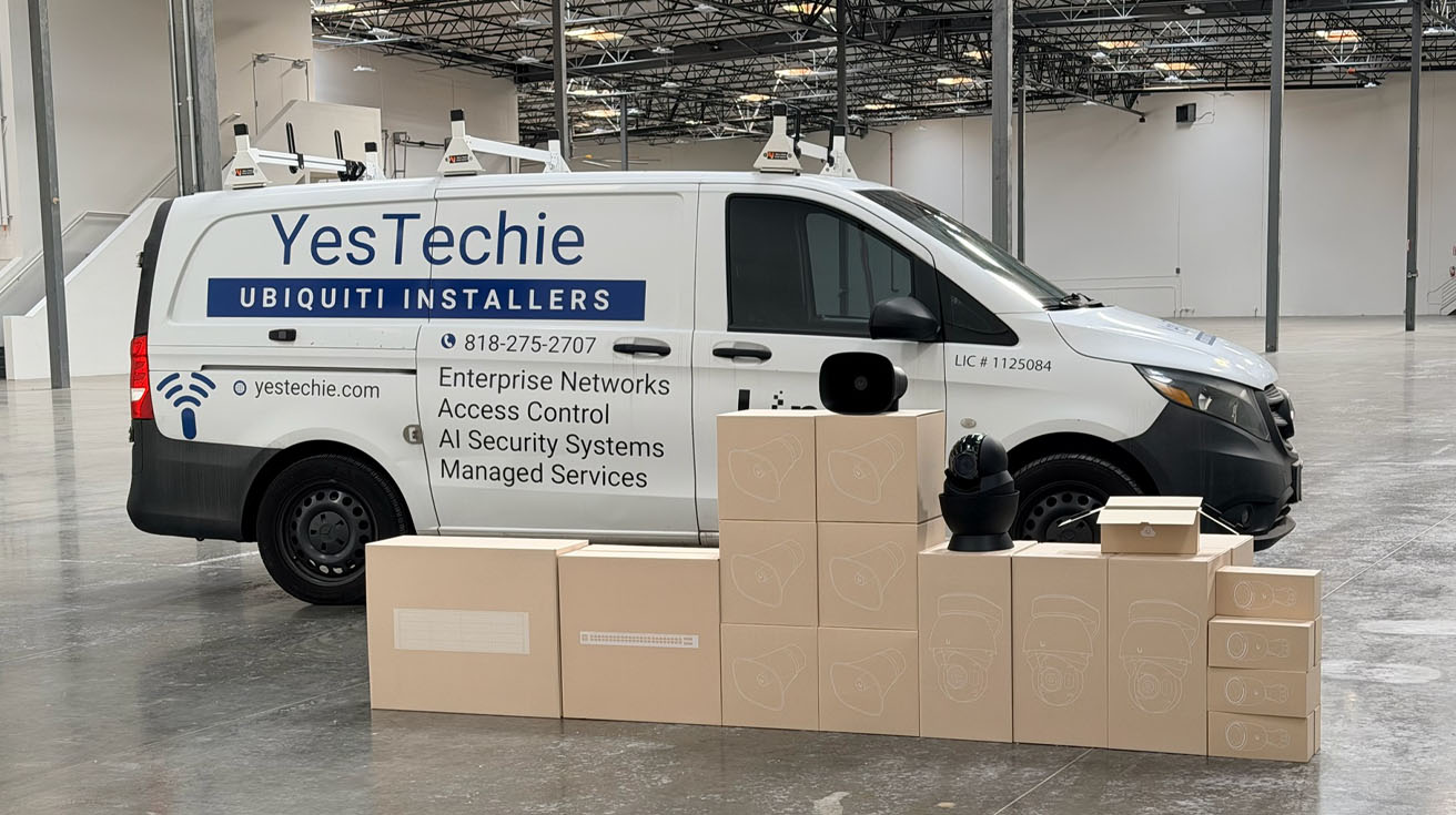 A YesTechie branded installation van equipped with Ubiquiti enterprise networking hardware for emergency response.