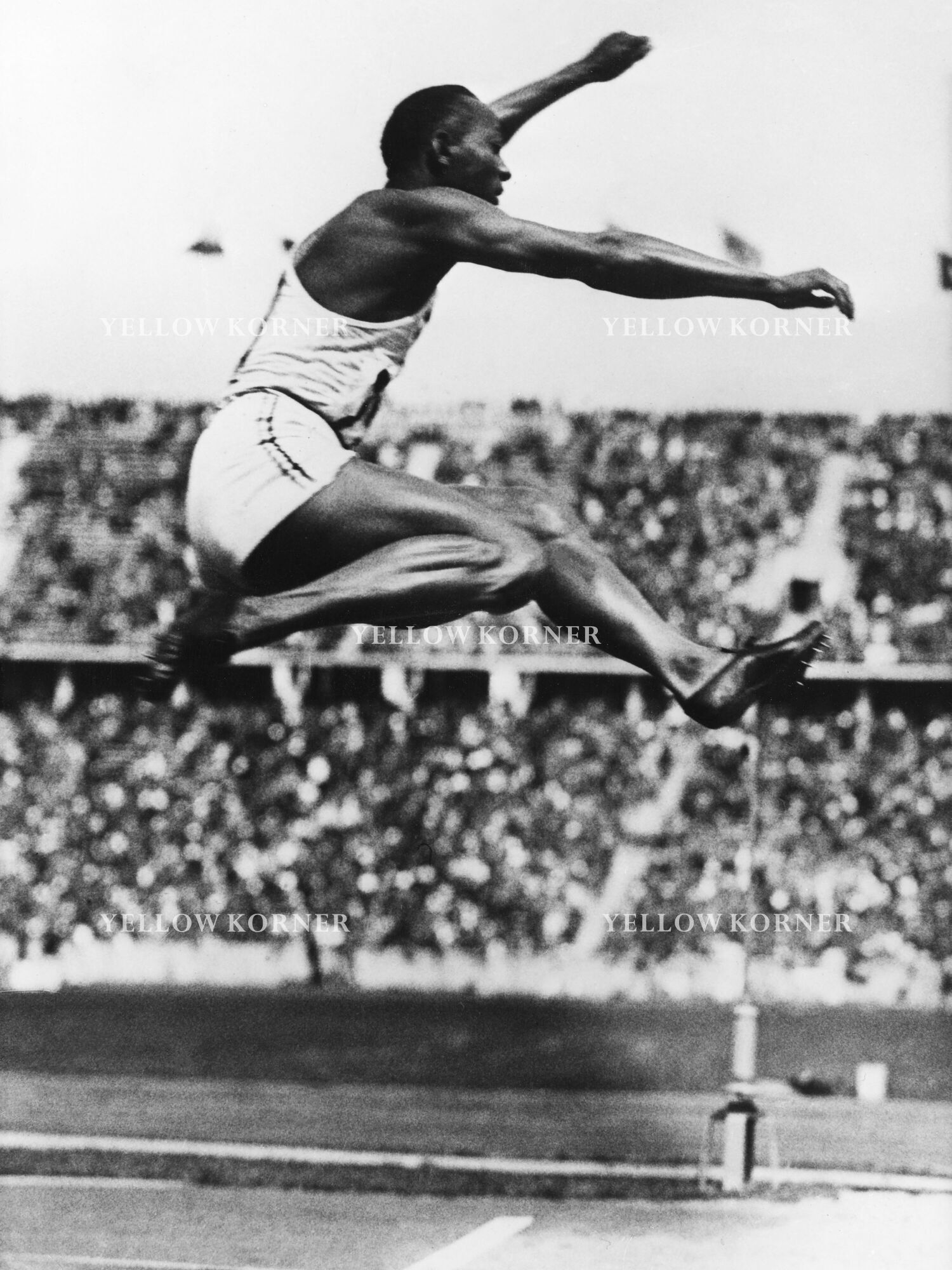 Saut En Longueur Masculin Aux Jeux Olympiques D'été De 1936 Jesse Owens pendant l'épreuve de saut en longueur aux Jeux Olympiques d