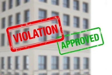 Resolving building code violations for real estate compliance