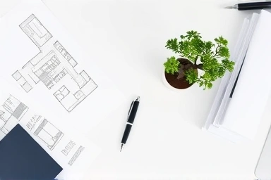 Real estate investment, financial planning, blueprints, bonsai tree, strategic decisions