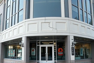 Deceptive commercial building facade with hidden warning signs