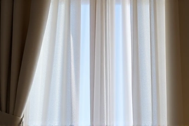 Detailed view of thick, insulating curtains creating a thermal barrier