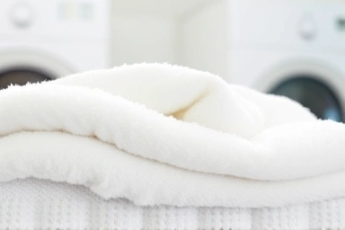 Soft, fluffy towels symbolizing clean laundry.