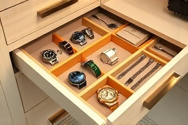 Detail of organized accessory drawer in a custom closet.