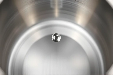 Interior of hygienic stainless steel electric kettle, seamless surface.