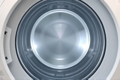 Pristine washing machine drum symbolizing cleanliness.